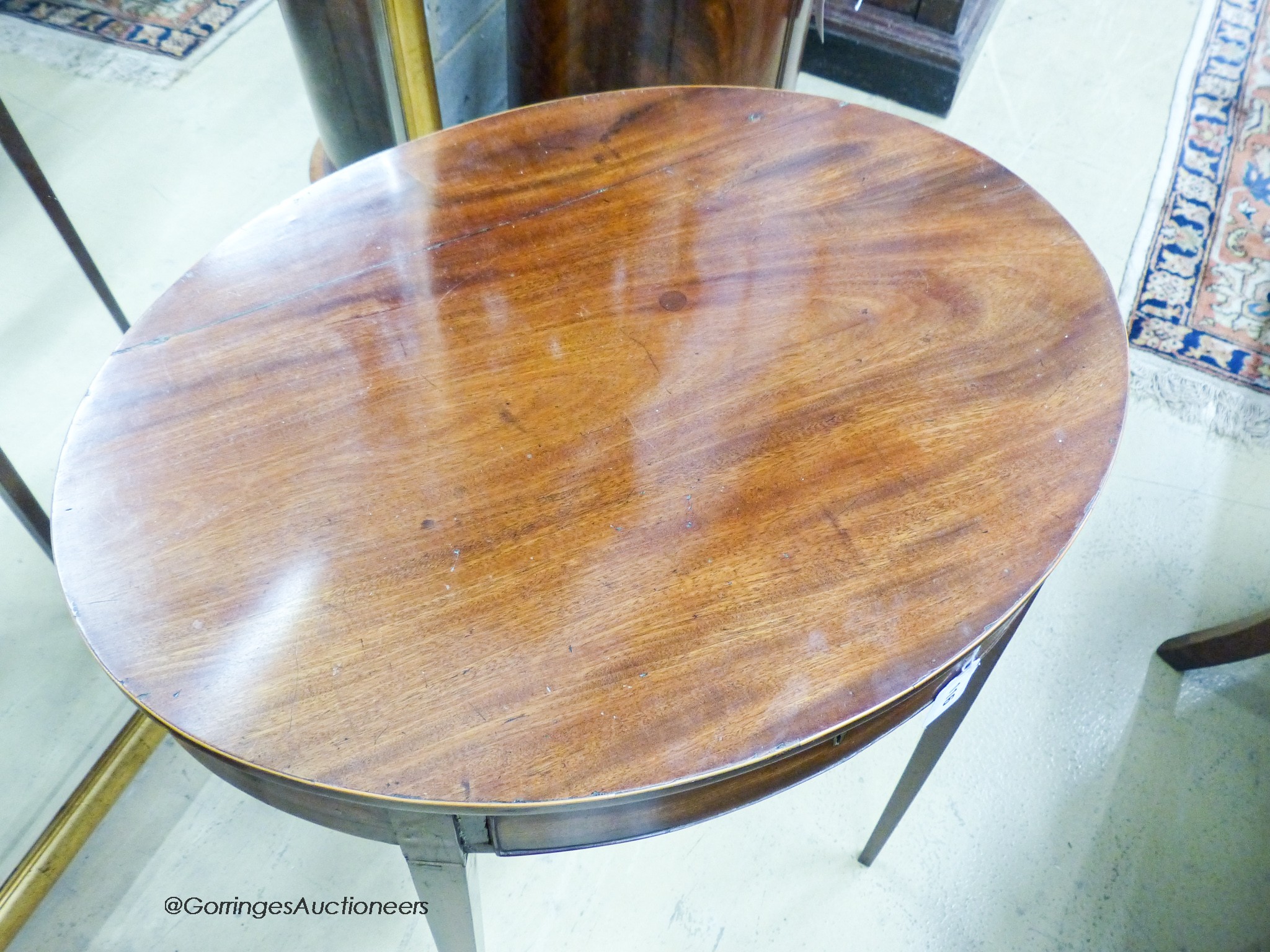 An early 19th century and later oval mahogany table, width 65cm, depth 49cm, height 67cm